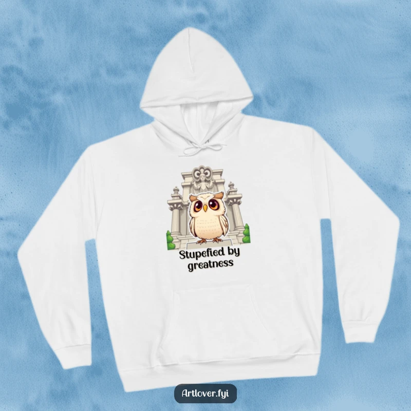 Funny owl hoodie with a surprised owl and large eyes gazing up at a grand statue, offering warmth and amusement.
