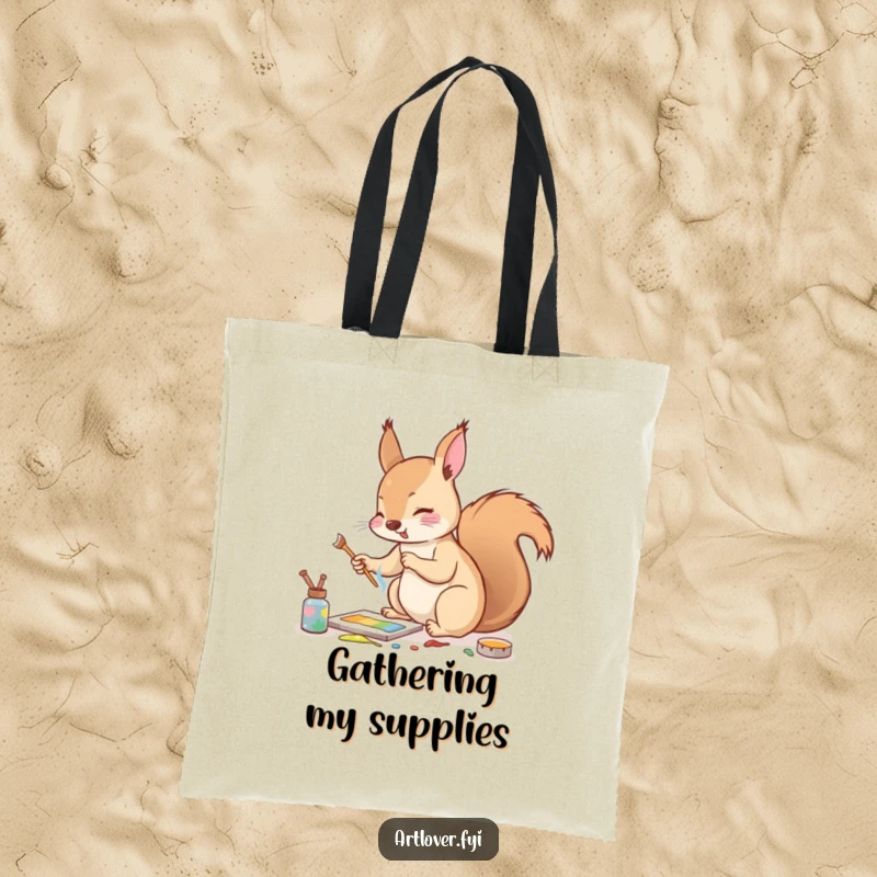Funny tote bag with an enthusiastic squirrel mixing paints with a tiny twig, perfect for carrying art supplies or essentials.